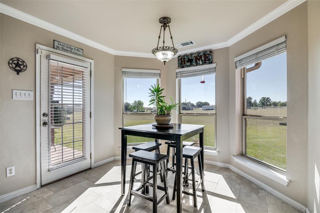 13064 Highland Court Forney, TX 75126 - Photo 15 of 25 a view of a dining room with furniture window and outside view