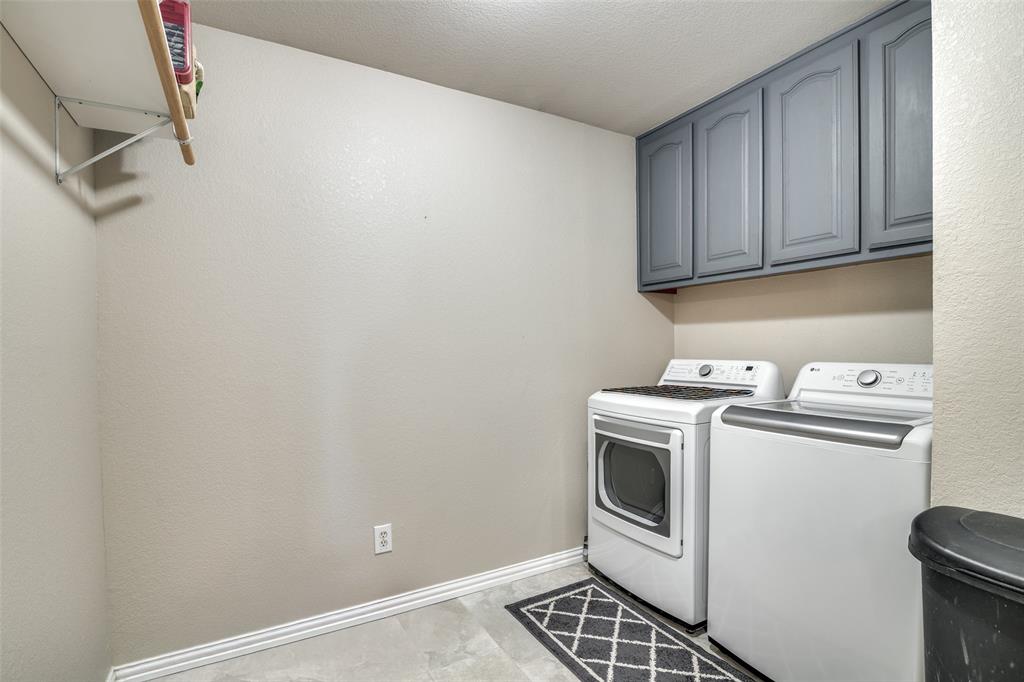 13064 Highland Court Forney, TX 75126 - Photo 16 of 25 a view of a storage and utility room with washer and dryer