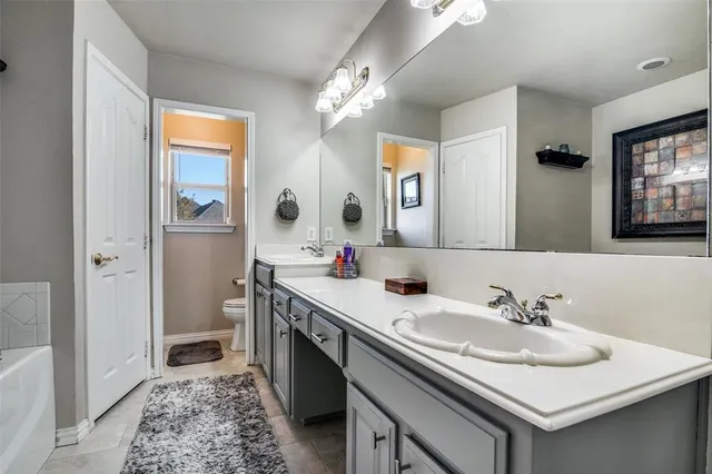 a bathroom with a sink double vanity and a mirror