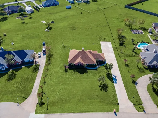 a view of house with backyard