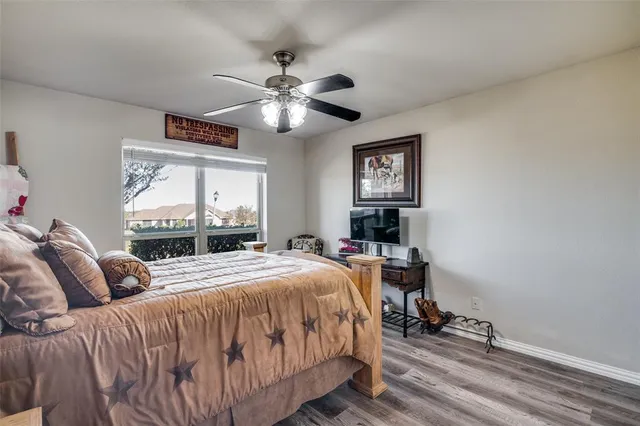 a bedroom with a large bed and a window
