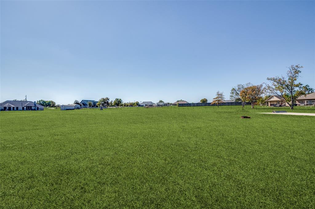 13064 Highland Court Forney, TX 75126 - Photo 25 of 25 a view of yard with grass & house
