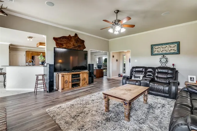 a living room with furniture and a flat screen tv