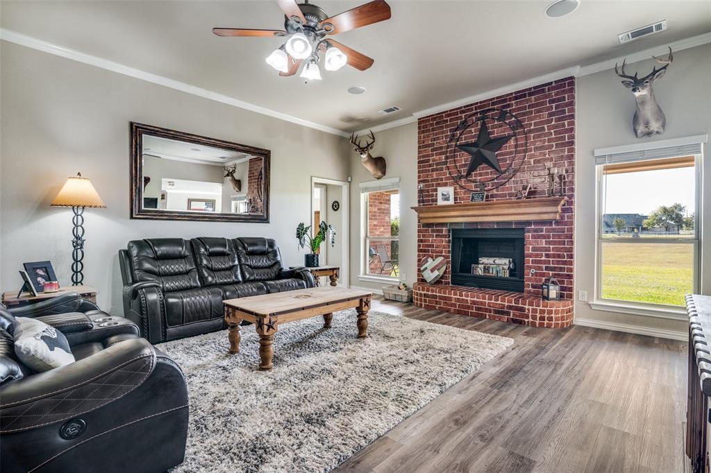 13064 Highland Court Forney, TX 75126 - Photo 10 of 25 a living room with furniture and a fireplace