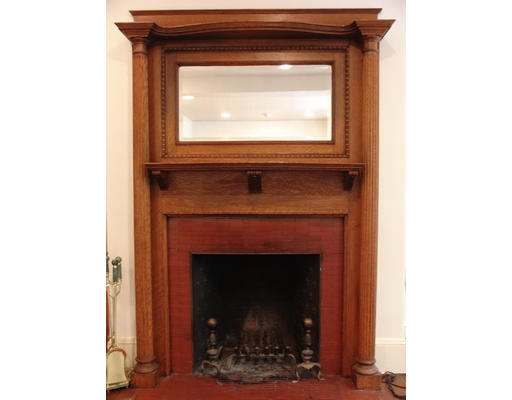 26 Beaufort Road, Unit 2 Boston, MA 02130 - Photo 3 of 8 a living room with a fireplace