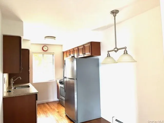 a kitchen with refrigerator and washer