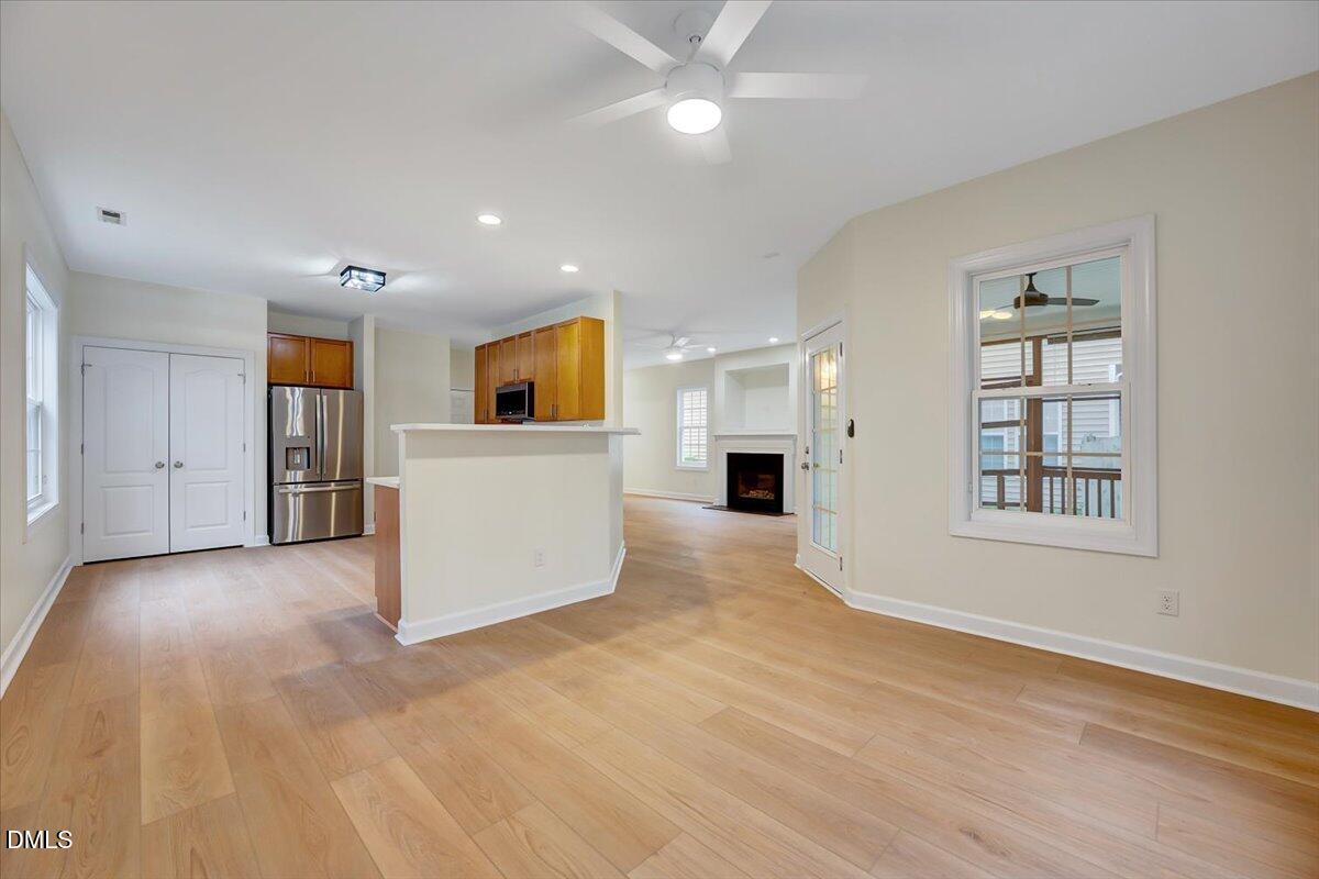 3218 Trassacks Drive Raleigh, NC 27610 - Photo 11 of 37 a view of an empty room with a kitchen