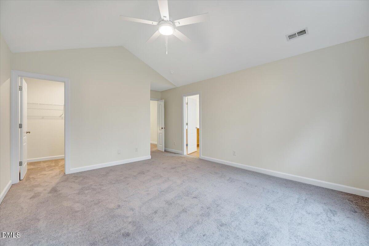 3218 Trassacks Drive Raleigh, NC 27610 - Photo 19 of 37 an empty room with a ceiling fan and a fan