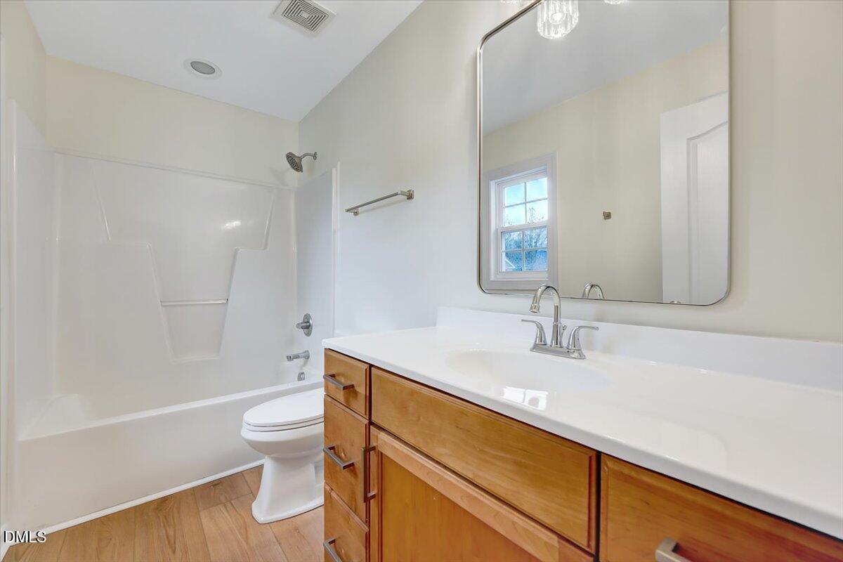 3218 Trassacks Drive Raleigh, NC 27610 - Photo 28 of 37 a bathroom with a sink a toilet and shower