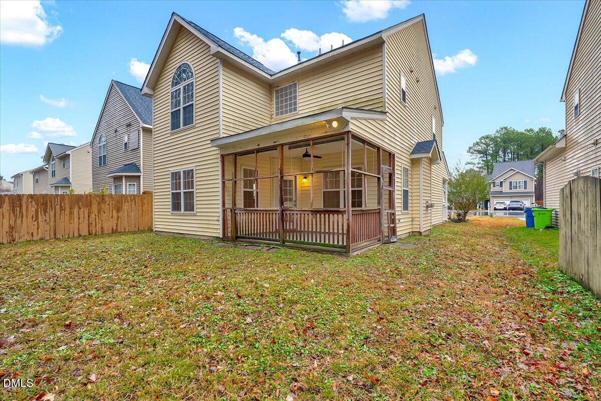 3218 Trassacks Drive Raleigh, NC 27610 - Photo 29 of 37 a view of a house with a yard and fence