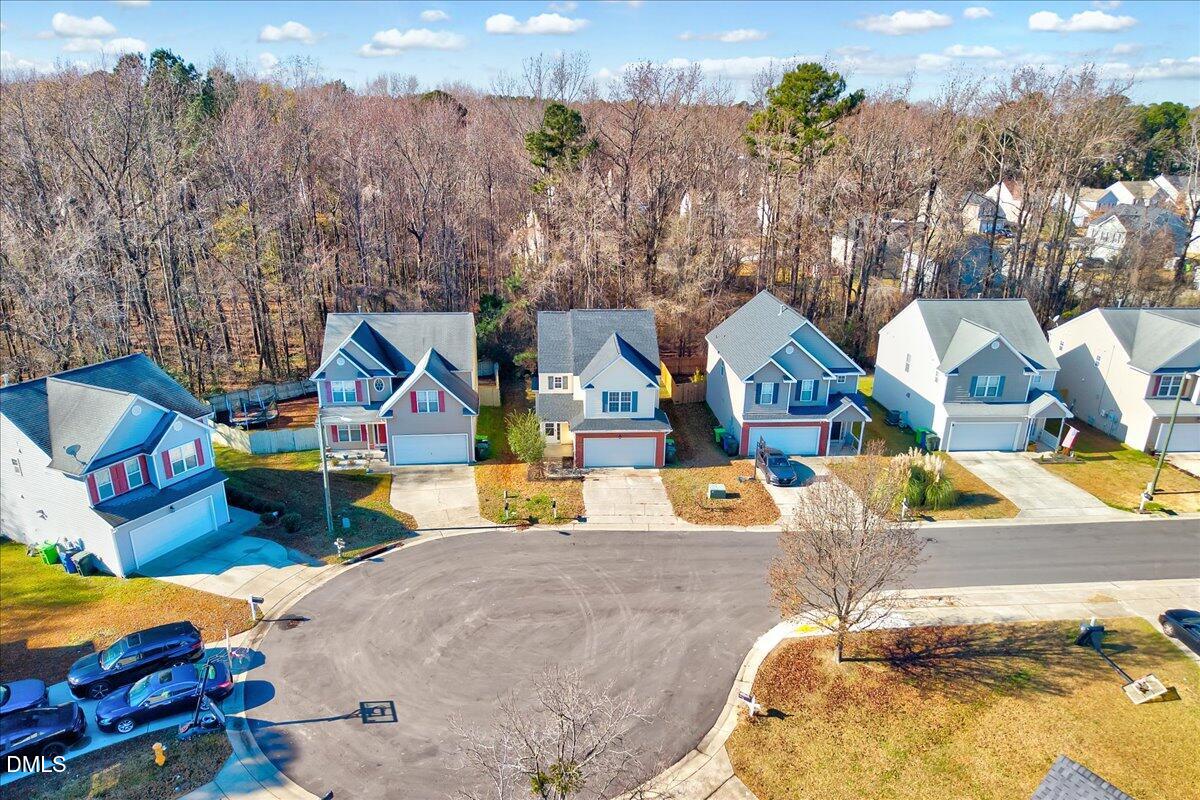 3218 Trassacks Drive Raleigh, NC 27610 - Photo 32 of 37 an aerial view of a house with swimming pool and large trees