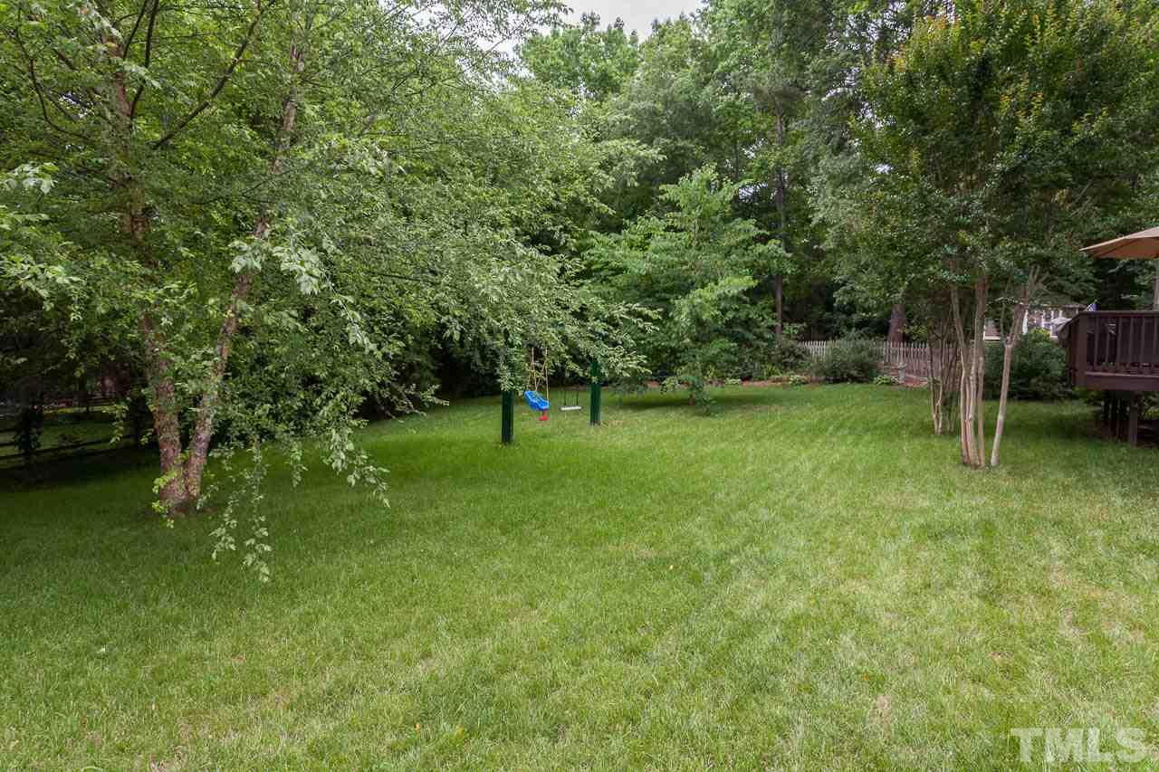 7317 Ridge Grove Court Raleigh, NC 27615 - Photo 14 of 25 a view of a tree in a yard