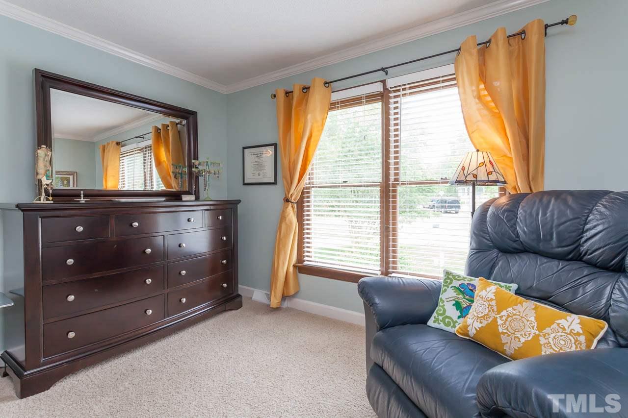 7317 Ridge Grove Court Raleigh, NC 27615 - Photo 17 of 25 a living room with furniture and a window