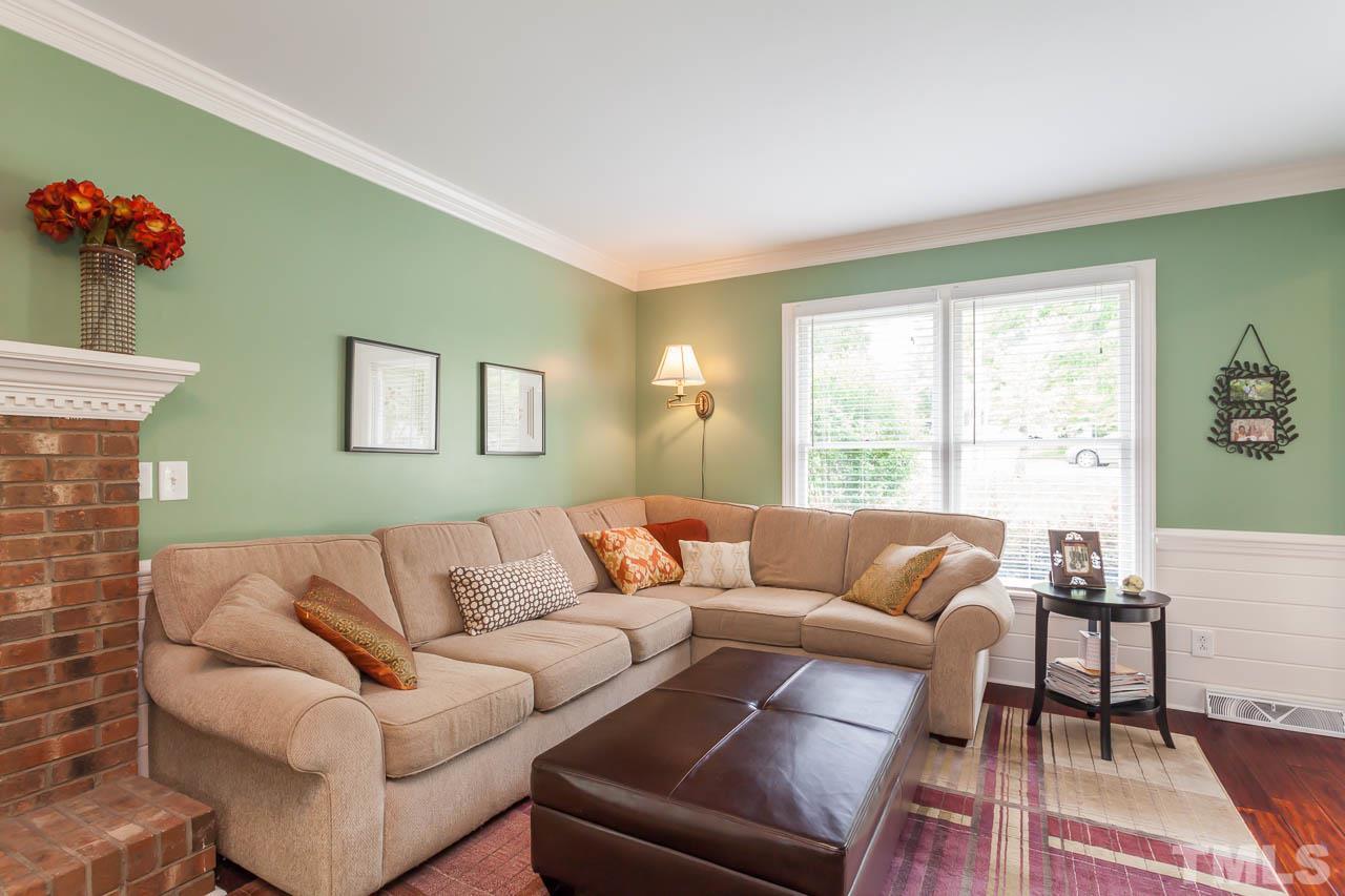 7317 Ridge Grove Court Raleigh, NC 27615 - Photo 19 of 25 a living room with furniture and a large window