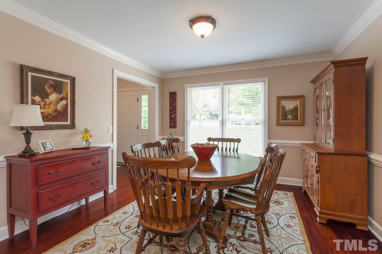 7317 Ridge Grove Court Raleigh, NC 27615 - Photo 4 of 25 a view of a dining room with furniture and window