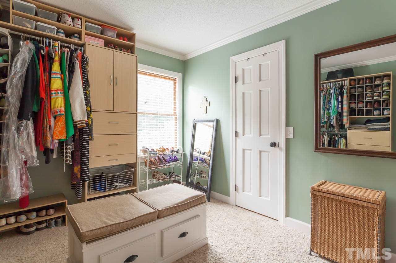7317 Ridge Grove Court Raleigh, NC 27615 - Photo 7 of 25 a view of walk in closet with clothes and shoes