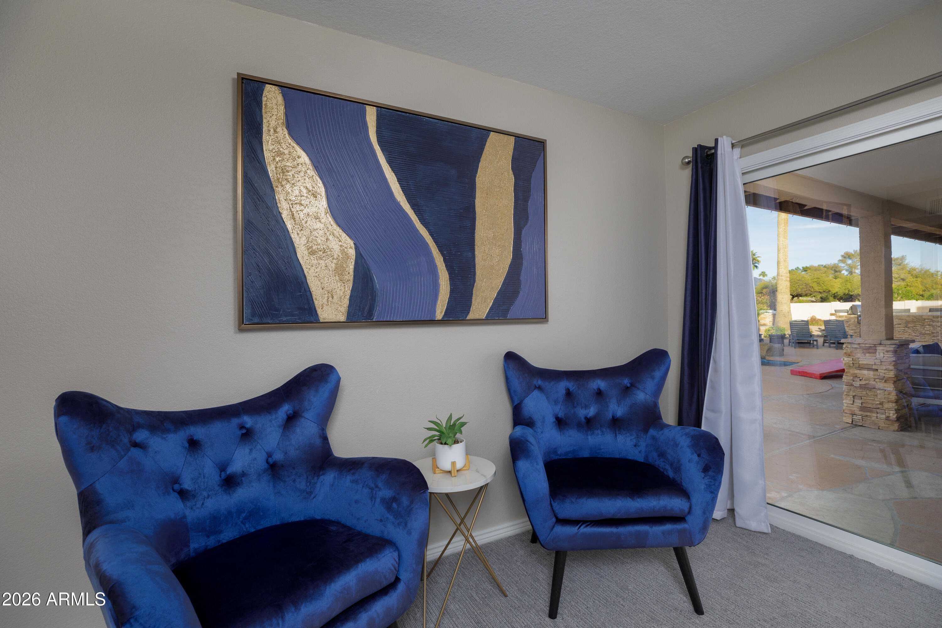 6932 East Presidio Road Scottsdale, AZ 85254 - Photo 19 of 30 a living room with furniture and a chair