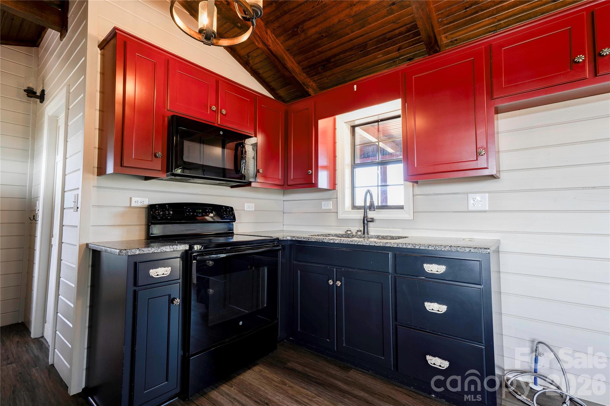 101 Hull Road Casar, NC 28020 - Photo 11 of 25 a kitchen with stainless steel appliances granite countertop a stove microwave and cabinets