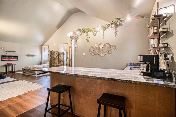 a dining room with a table and chairs