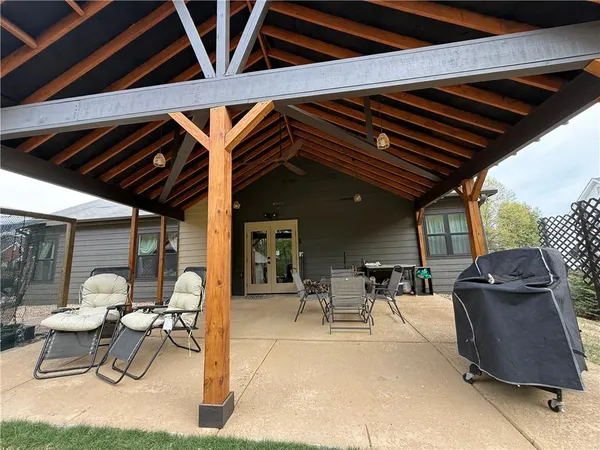a patio with table and chairs