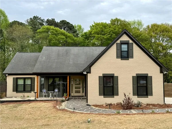 a front view of a house with garden