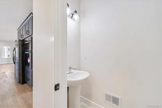 a bathroom with a sink and mirror