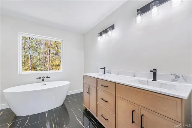 a bath room with a sink and a mirror