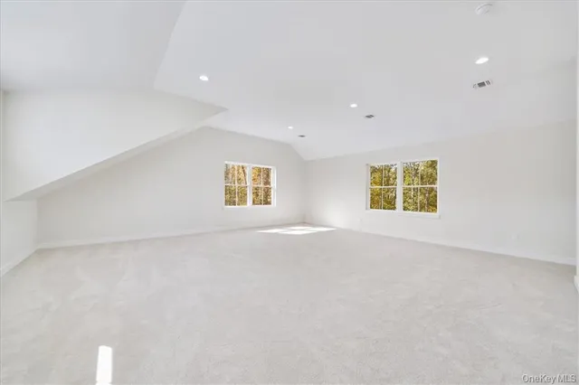 an empty room with a empty space and window