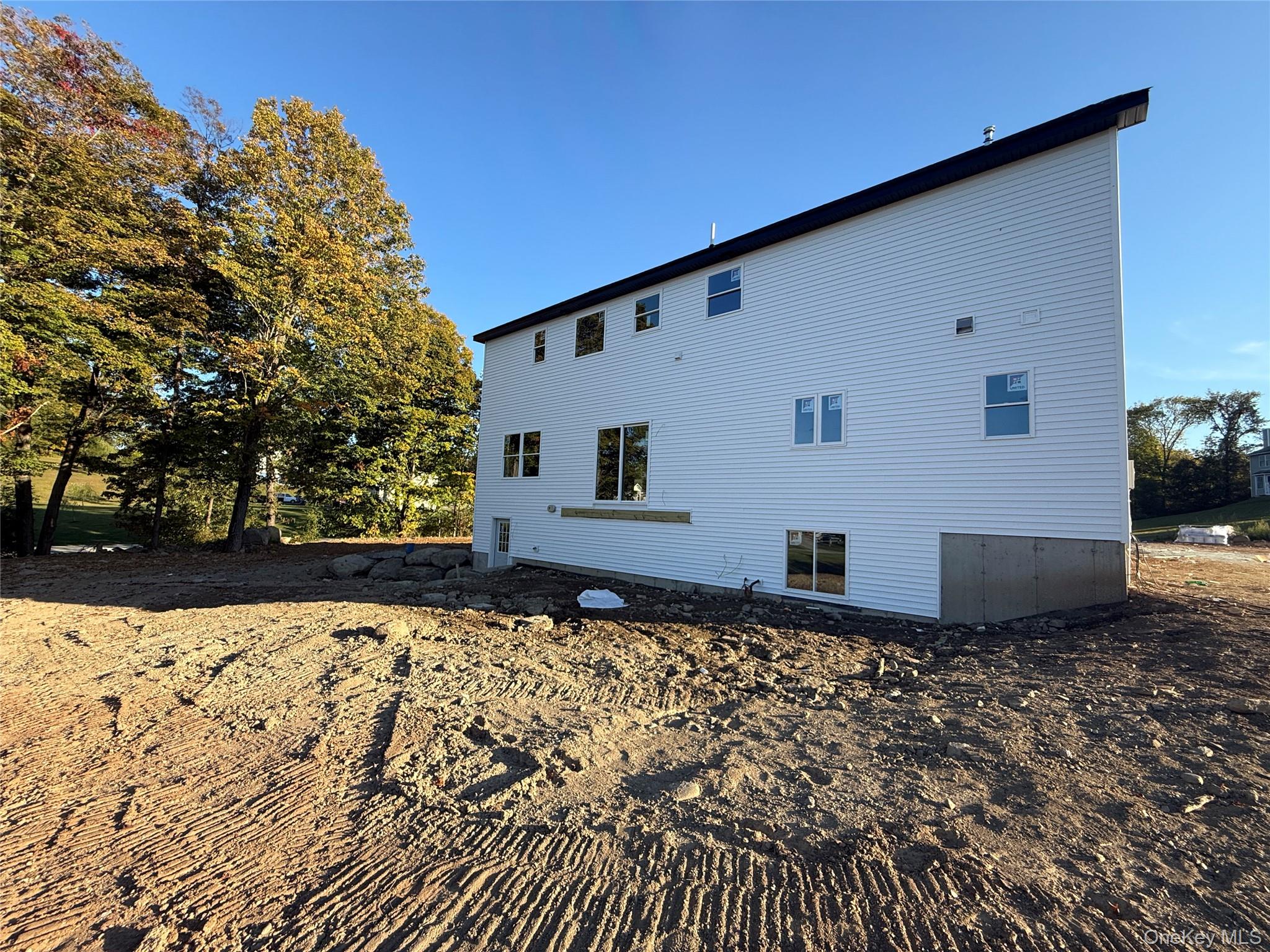 Lot 13-27 Sawyer Way Wallkill, NY 12589 - Photo 32 of 35 a front view of a house with a yard