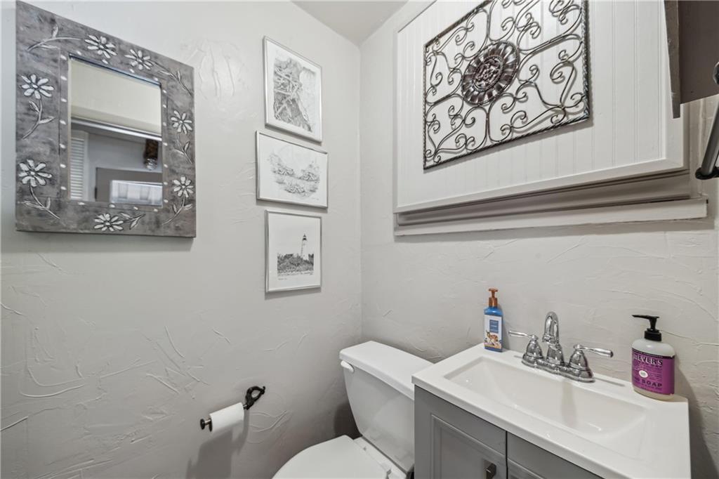 122 Klir Road Pittsburgh, PA 15209 - Photo 5 of 31 a bathroom with a toilet sink vanity and mirror