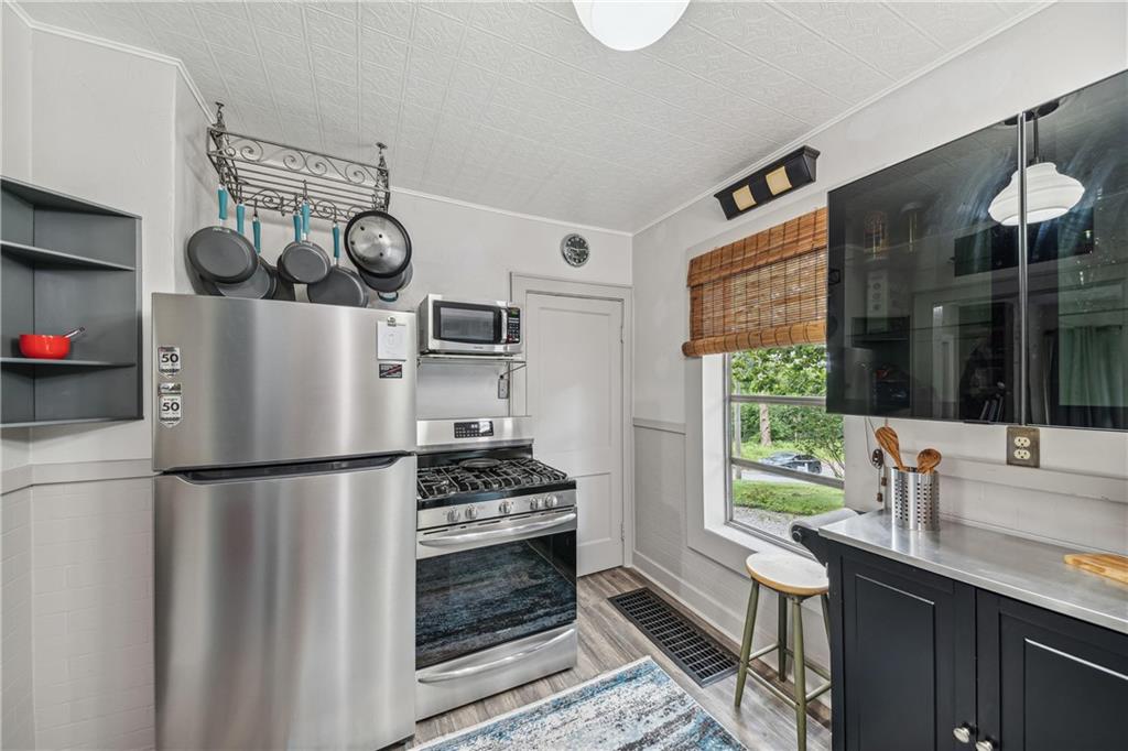 122 Klir Road Pittsburgh, PA 15209 - Photo 7 of 31 a kitchen with a refrigerator and a sink