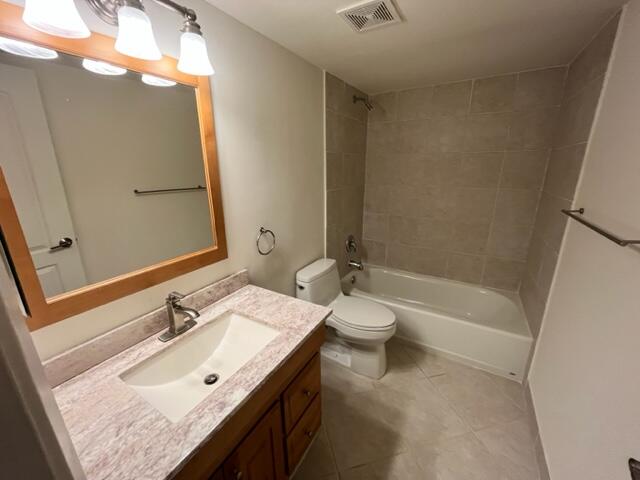 2255 Lindell Boulevard, Unit 4209 Delray Beach, FL 33444 - Photo 13 of 15 a bathroom with a granite countertop sink toilet and shower