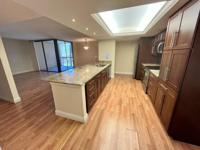 2255 Lindell Boulevard, Unit 4209 Delray Beach, FL 33444 - Photo 4 of 15 a view of kitchen with sink and refrigerator