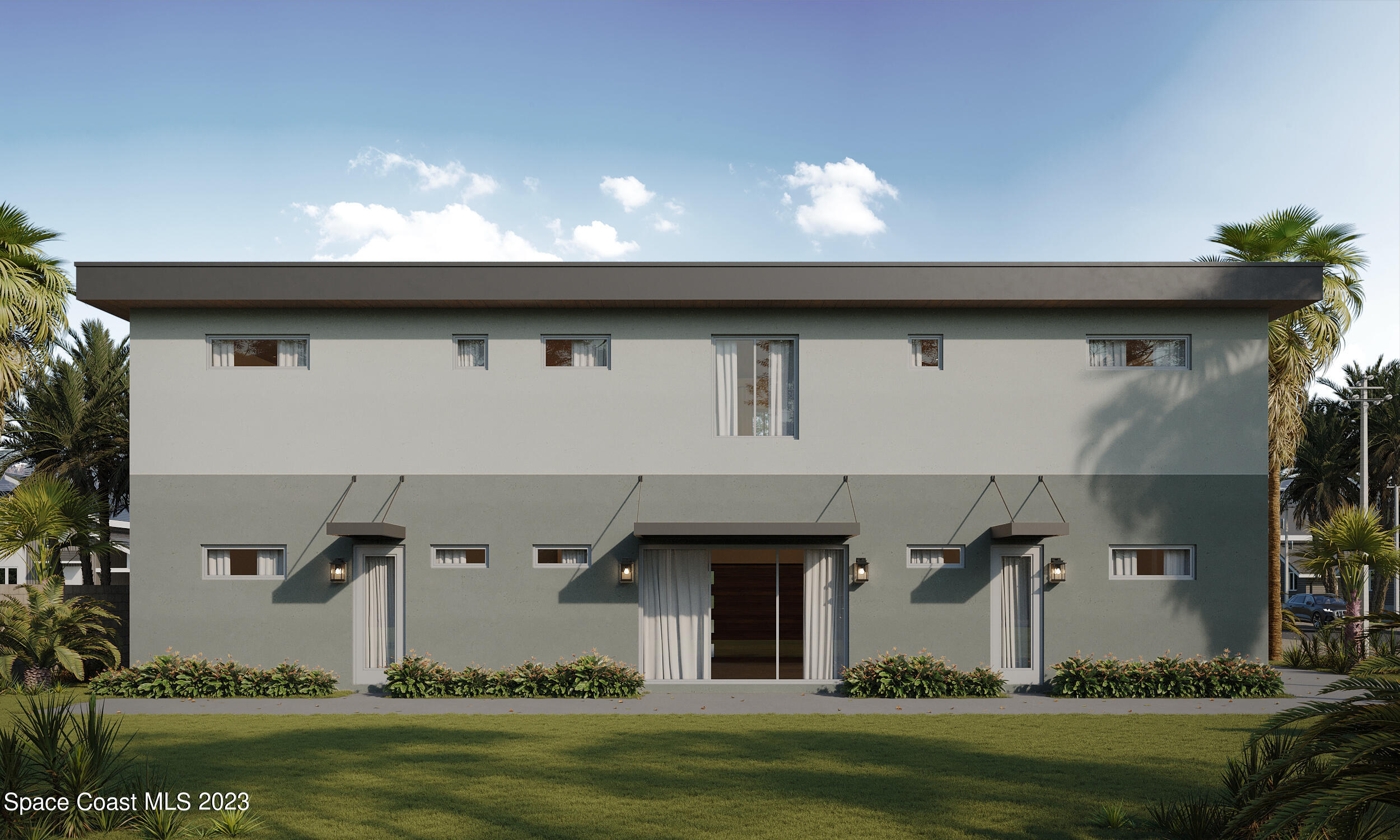 101 10th Avenue Indialantic, FL 32903 - Photo 3 of 16 a front view of a house with a yard