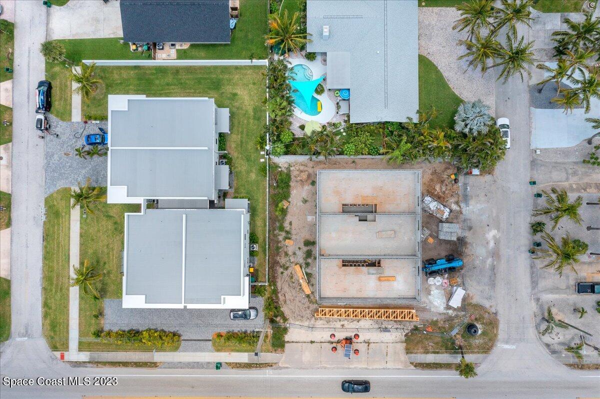 101 10th Avenue Indialantic, FL 32903 - Photo 8 of 16 an aerial view of residential houses with outdoor space and parking