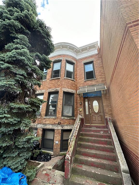 868 55th Street Brooklyn, NY 11220 - Photo 1 of 9 a front view of a house with a outdoor space