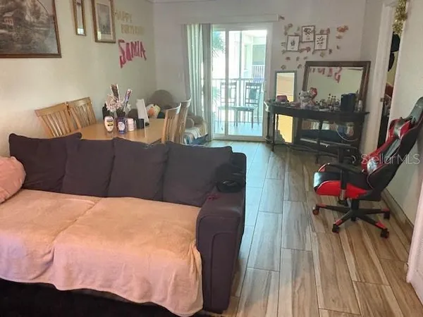 a living room with furniture and a window