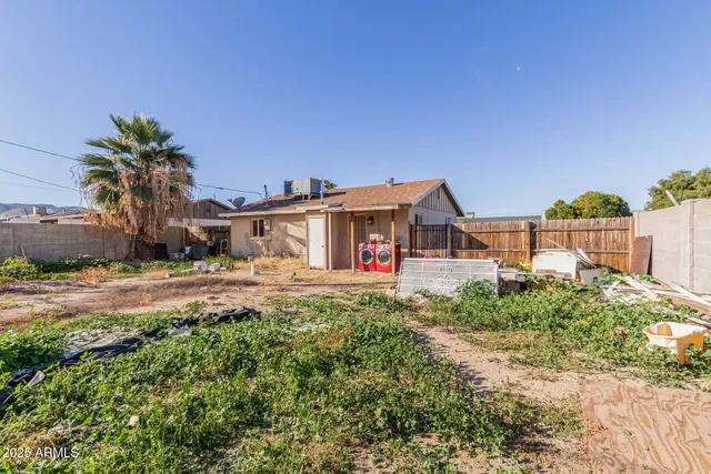 a view of house with outdoor space and sitting area