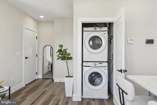 a view of a storage & utility room with a washer dryer