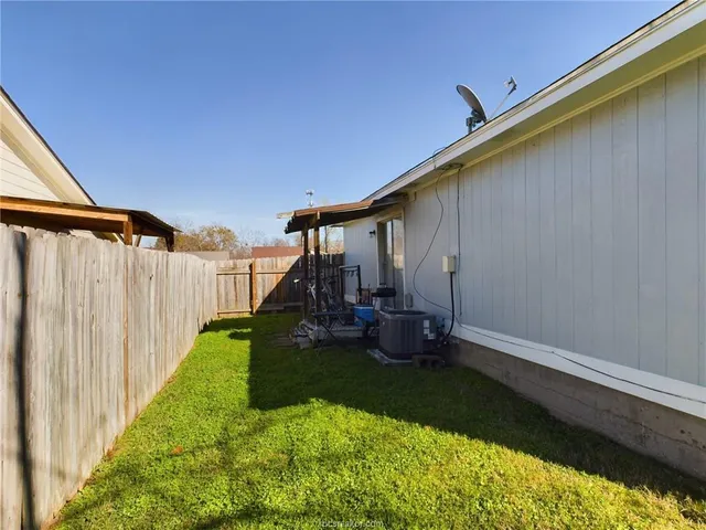 a view of a backyard with hardwood