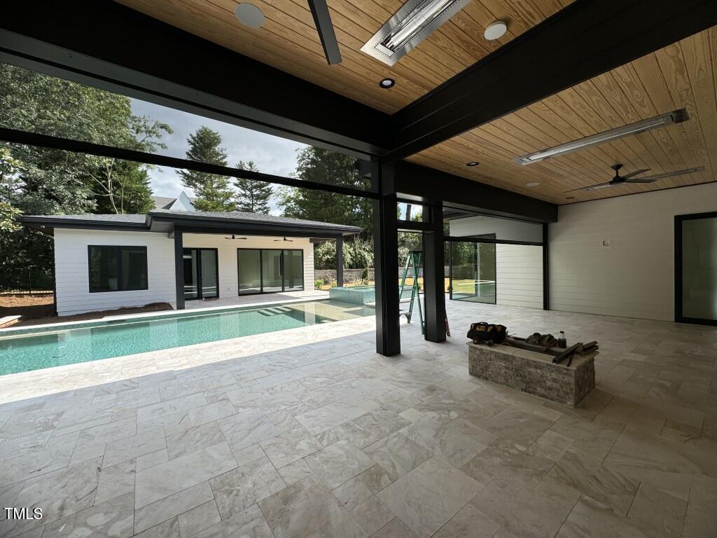 822 Cranbrook Road Raleigh, NC 27609 - Photo 17 of 60 a view of house with backyard outdoor seating and mountain view