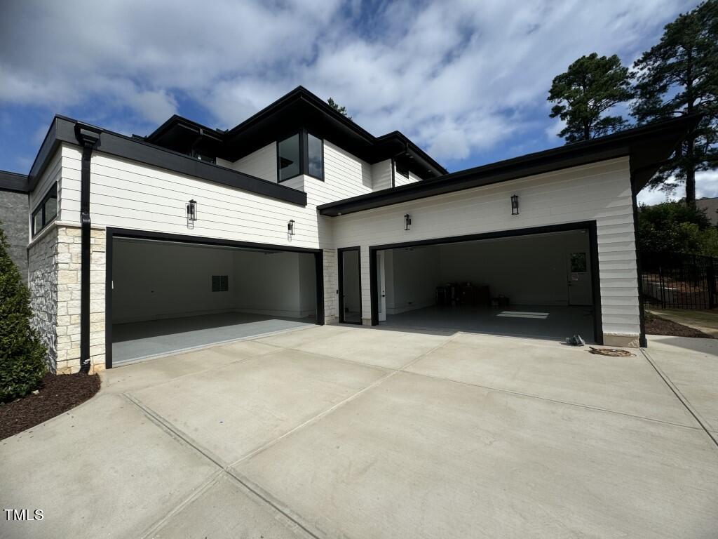 822 Cranbrook Road Raleigh, NC 27609 - Photo 3 of 60 a front view of a house with garage