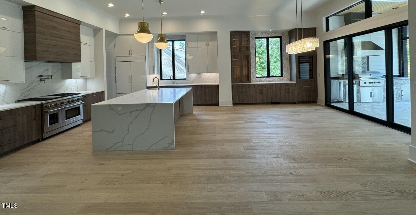 822 Cranbrook Road Raleigh, NC 27609 - Photo 5 of 60 a large kitchen with cabinets and a stove