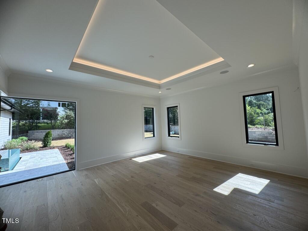 822 Cranbrook Road Raleigh, NC 27609 - Photo 10 of 60 a view of an empty room with a window
