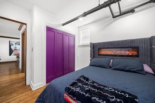 a bedroom with a bed and a tv on table