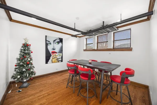 a view of a dining room with furniture and wooden floor