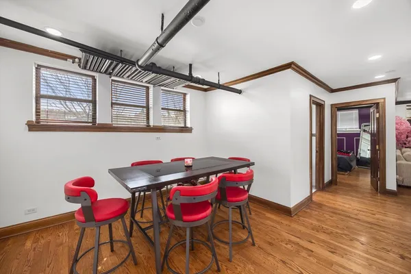 a view of a dining room with furniture wooden floor and a carpet