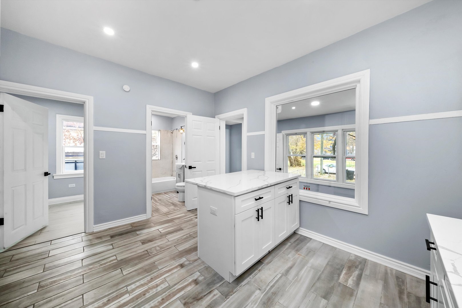 11730 South Perry Avenue Chicago, IL 60628 - Photo 14 of 25 a kitchen with stainless steel appliances granite countertop a stove and a refrigerator