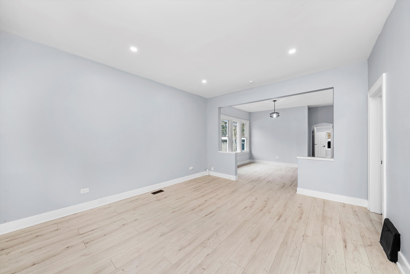 11730 South Perry Avenue Chicago, IL 60628 - Photo 4 of 25 a view of empty room with wooden floor