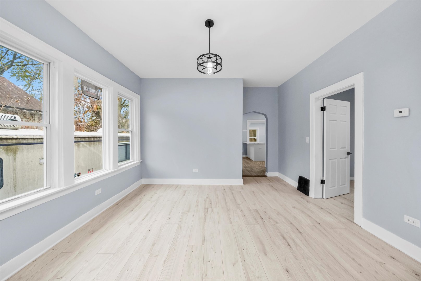 11730 South Perry Avenue Chicago, IL 60628 - Photo 6 of 25 a view of an empty room with a window